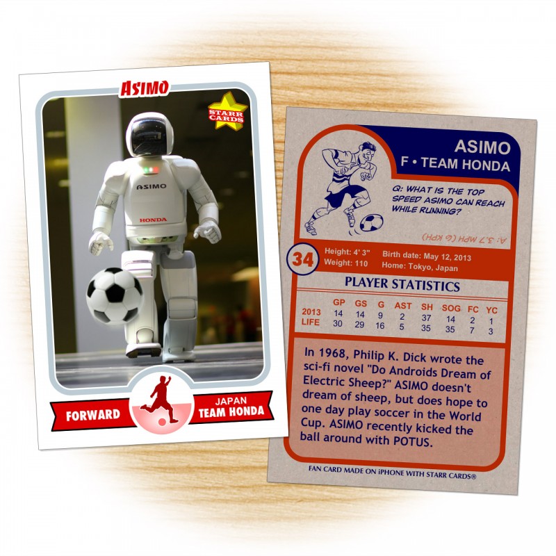 Asimo at a Honda factory kicking a soccer ball