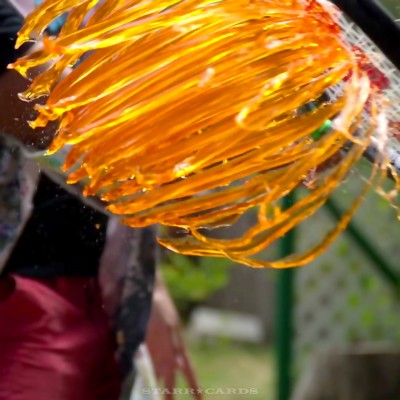 Orange Jell-O sliced up by a tennis racket